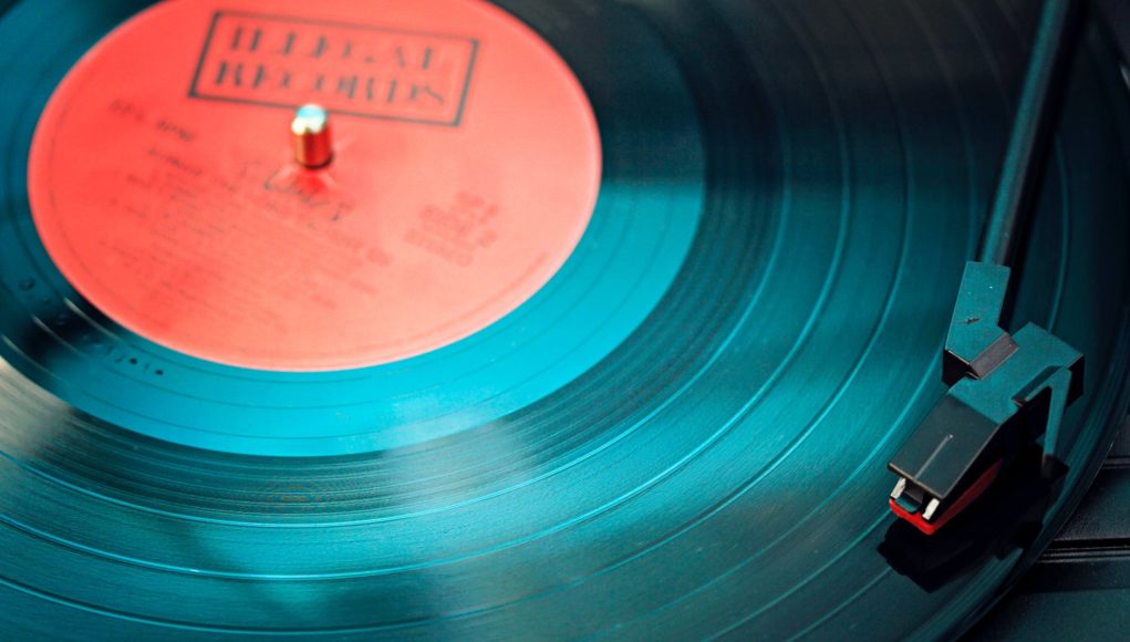 blue vinyl record playing on turntable