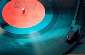 blue vinyl record playing on turntable