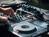 person playing dj mixer