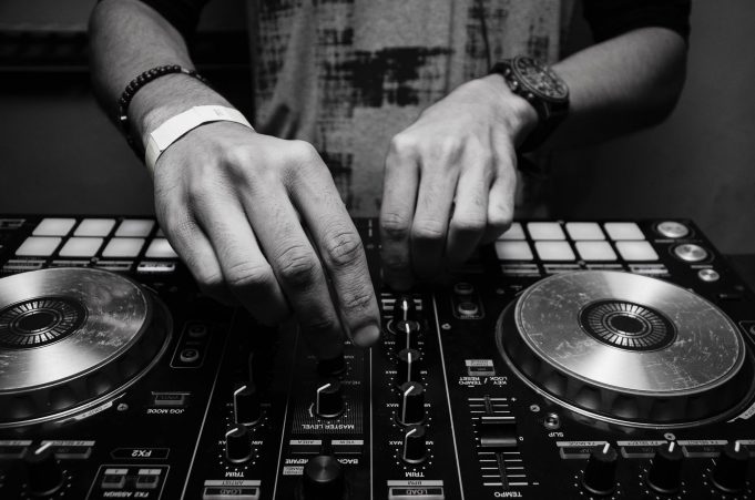lynyn – lexicon grayscale photography of person using dj controller