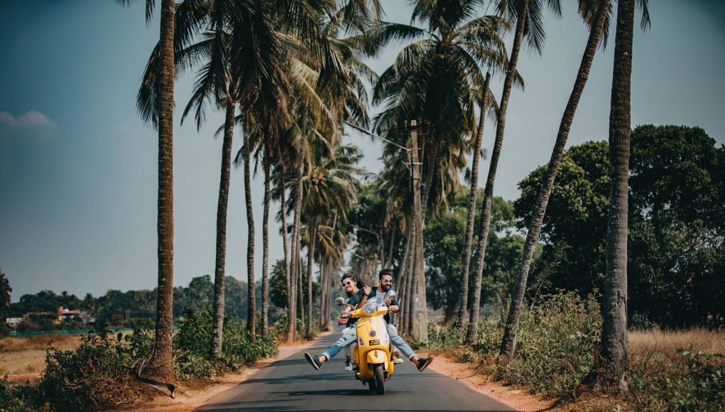 woman and man riding on motorcycle