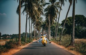 woman and man riding on motorcycle