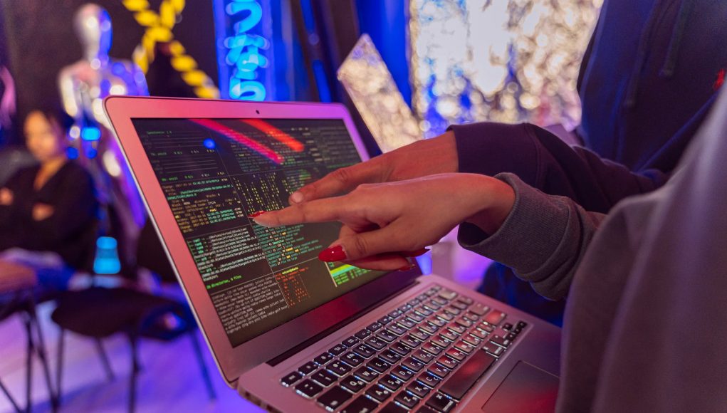 person using macbook air on table