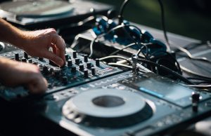 Max Cooper – Unspoken Words person playing dj mixer