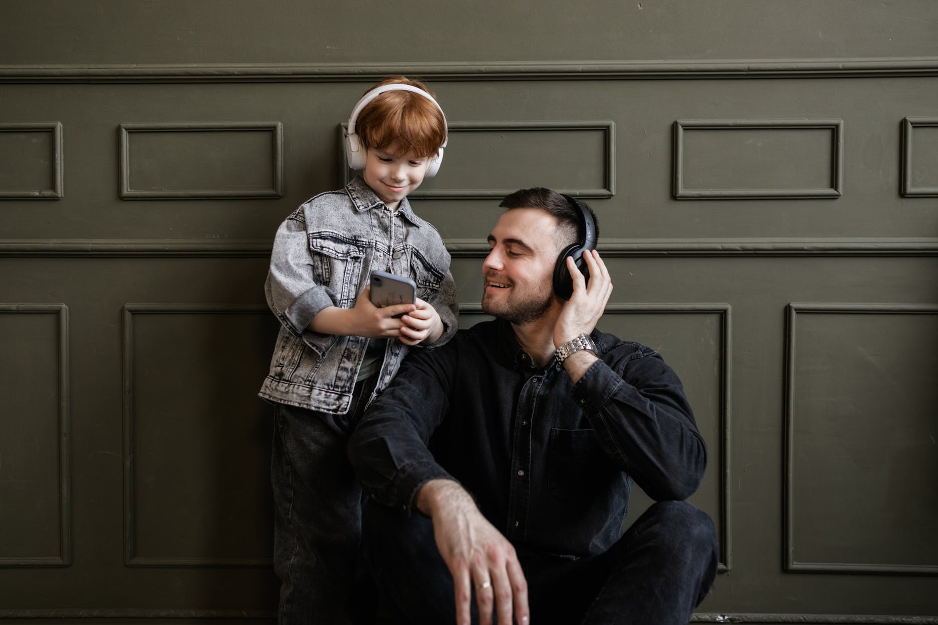 father and son listening to music