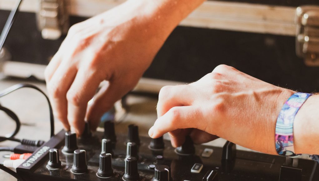 dj making tune with musical equipment