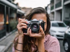 woman using slr camera